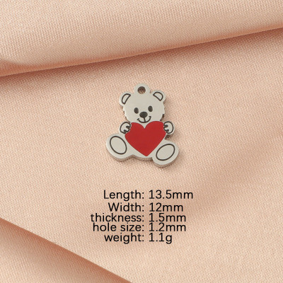 Teddy bear pendant with a heart, surgical steel