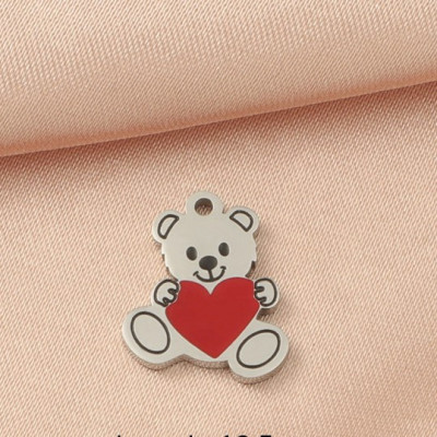 Teddy bear pendant with a heart, surgical steel