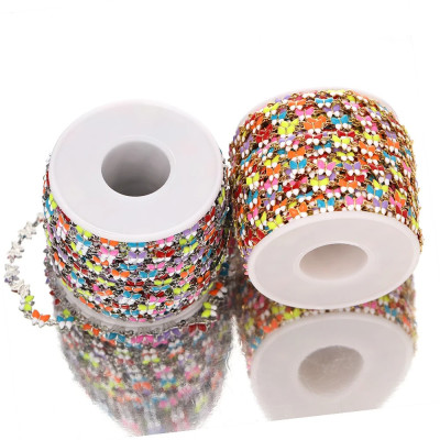 Chain in gold galvanization with colorful surgical steel bow ties