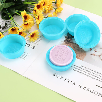 Round silicone mold for making soap with the inscription HAND MADE