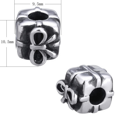 Bead with a large bow wrapped gift of surgical steel