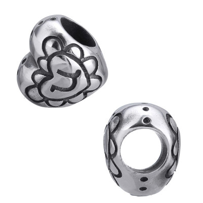 Heart-shaped bead with surgical steel ornaments