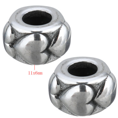 Surgical steel bead with embossed hearts