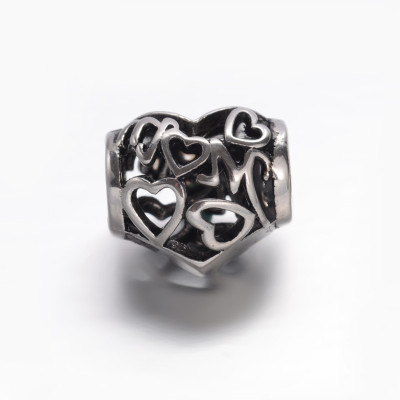 Surgical steel filigree heart bead